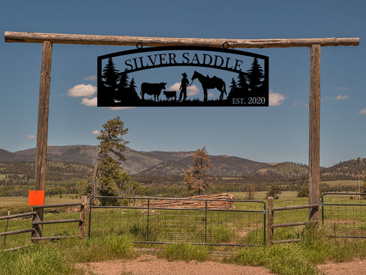 Large Entrance/Gate Ranch Sign with Cows and Rancher with a Horse